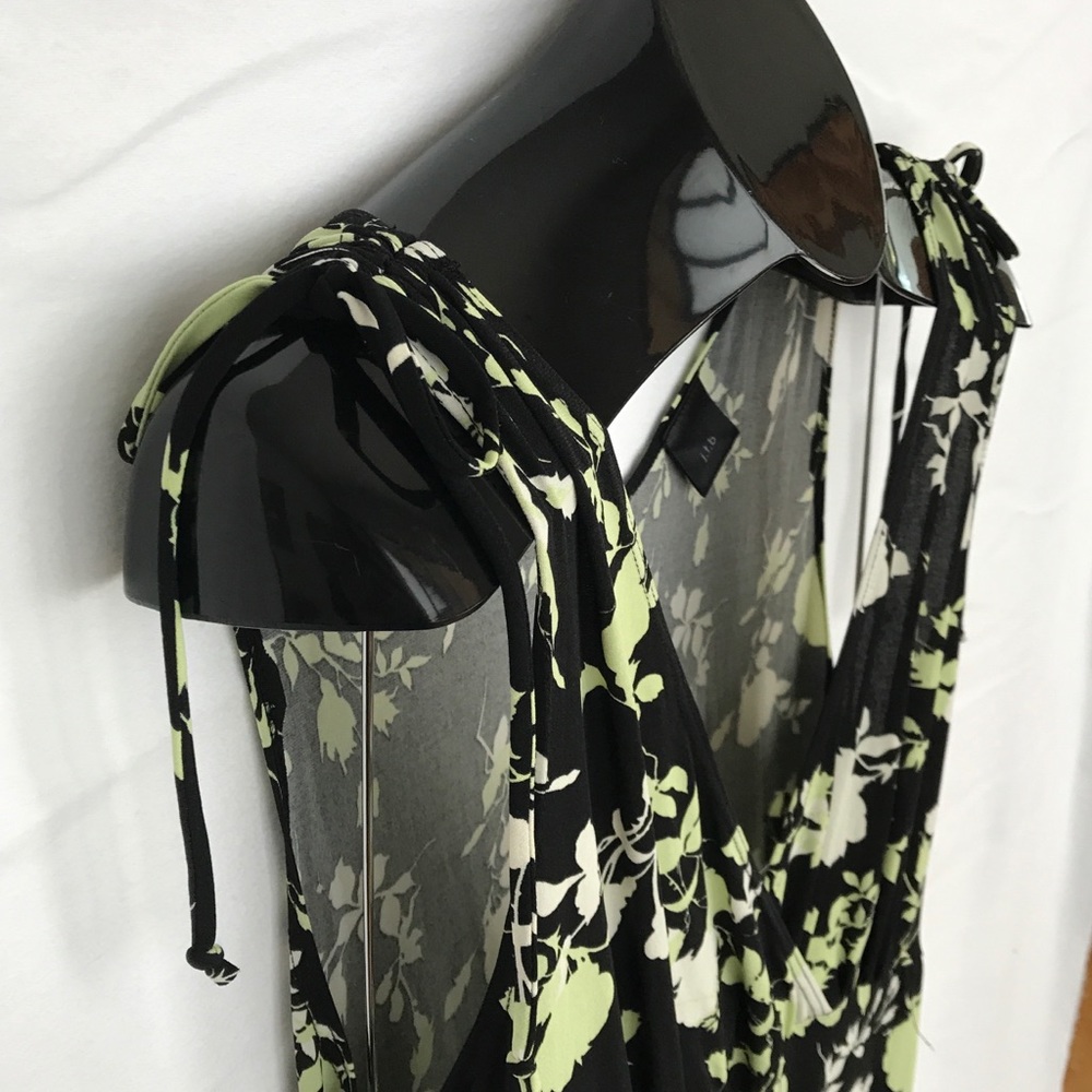 Knee length black dress with green pattern